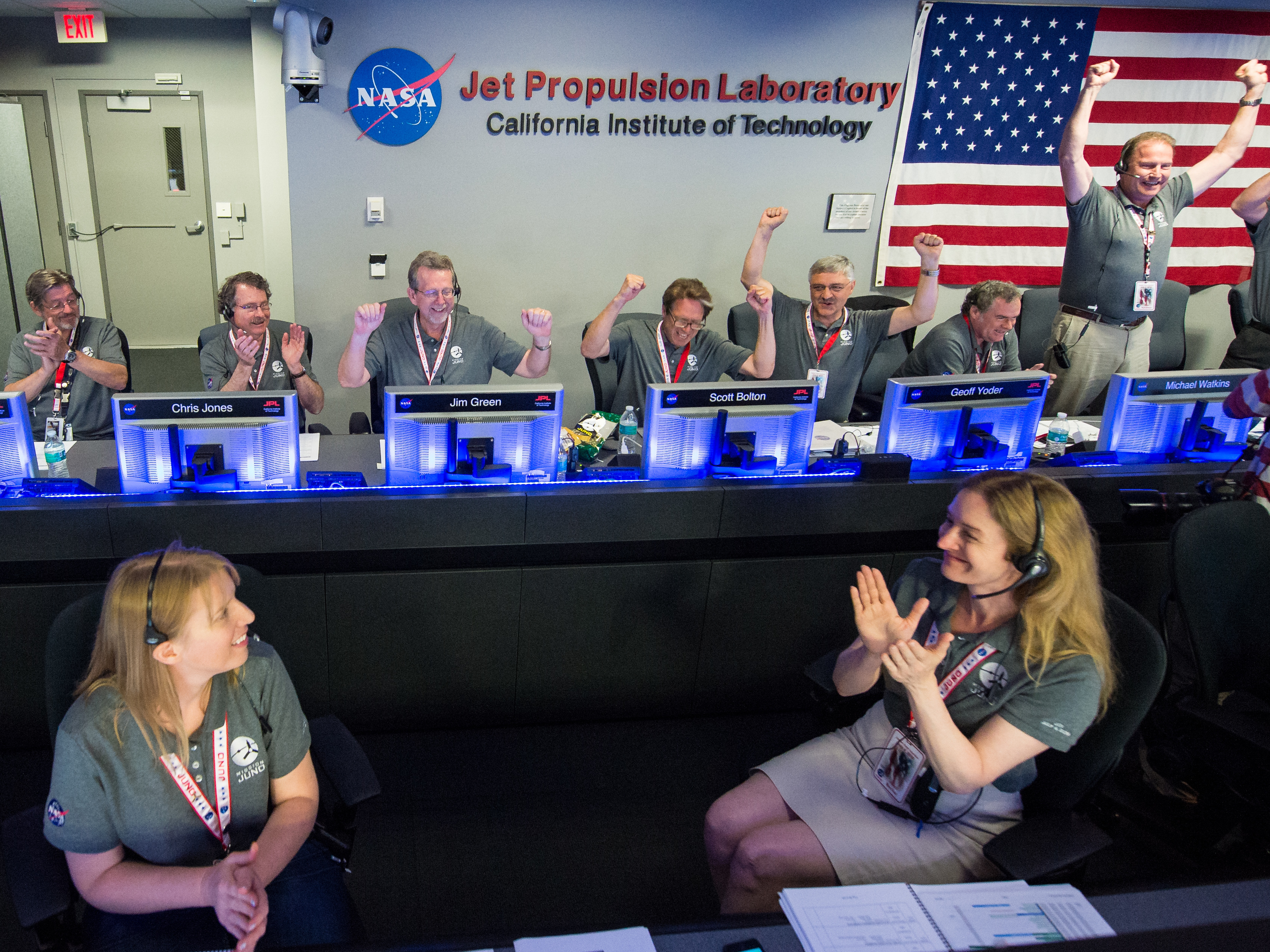 Members of the Juno team celebrate at the Jet Propulsion Laboratory in Pasadena, Calif., after they receive confirmation from the spacecraft that it successfully completed the engine burn and entered the orbit of Jupiter on July 4.