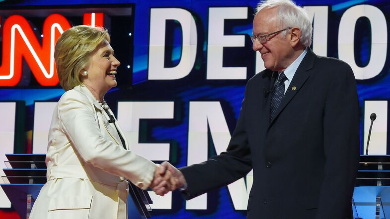 Hillary Clinton and Bernie Sanders shake hands before an April Democratic presidential debate in New York. (Jewel Samad/AFP/Getty Images)