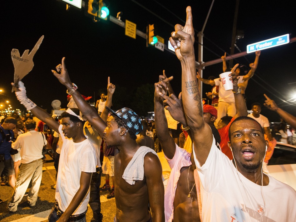 Protesters march Wednesday near the convenience store in Baton Rouge, La., where Alton Sterling was shot and killed. (Mark Wallheiser/Getty Images)