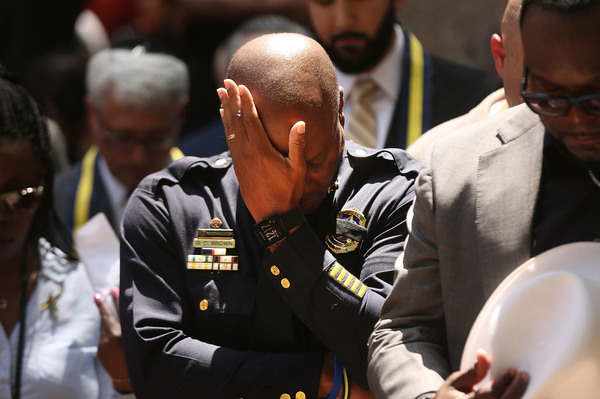 Dallas Police Chief David Brown pauses at a prayer vigil following the deaths of five police officers last night during a Black Lives Matter march.