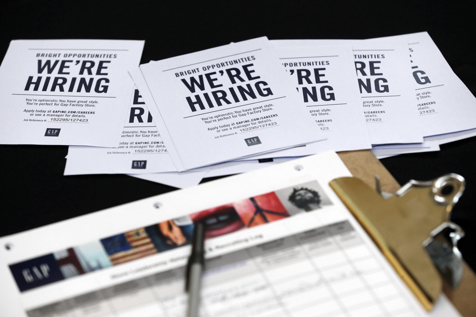 Job applications and information for the Gap Factory Store sit on a table during an October job fair at Dolphin Mall in Miami. (Wilfredo Lee/AP)