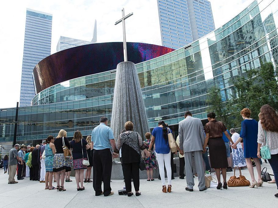 Parishioners of First Baptist Church in Dallas, Texas, gather on July 10, 2016, to pray for the five police officers killed when a man used a high-power rifle in a sniper attack at a protest in Dallas late July 7.