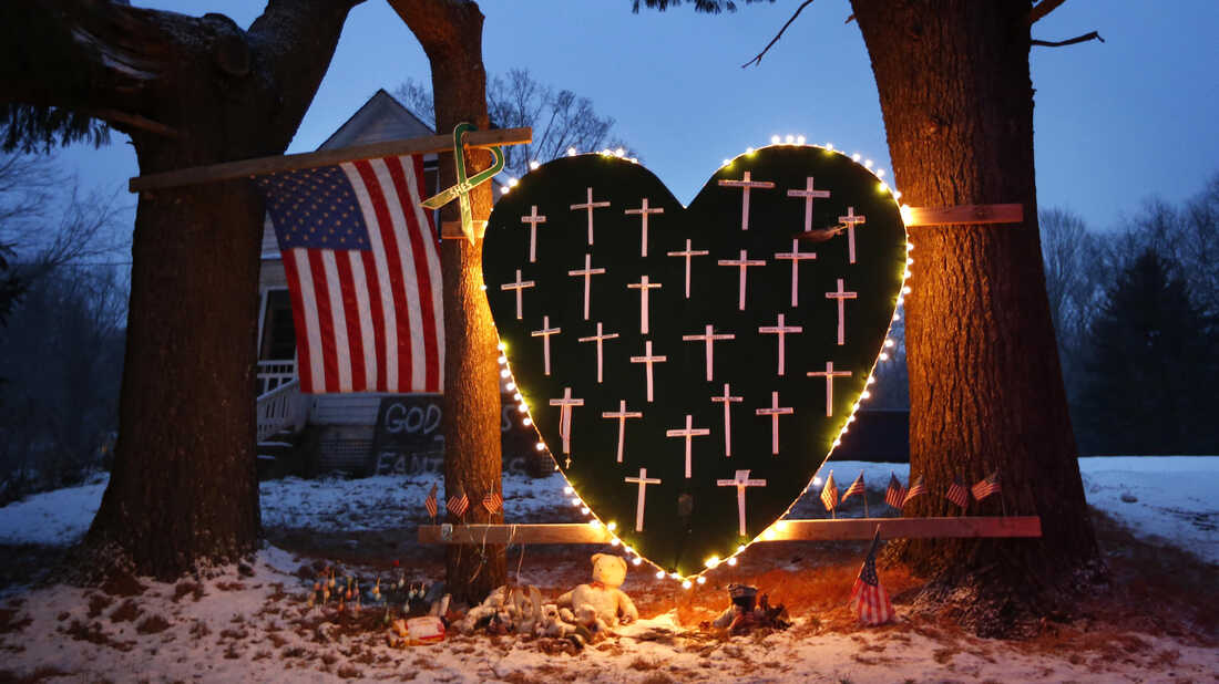 A makeshift memorial with crosses for the victims of the Sandy Hook Elementary School massacre stands outside a home in Newtown, Conn., in December 2013, a year after the shootings.