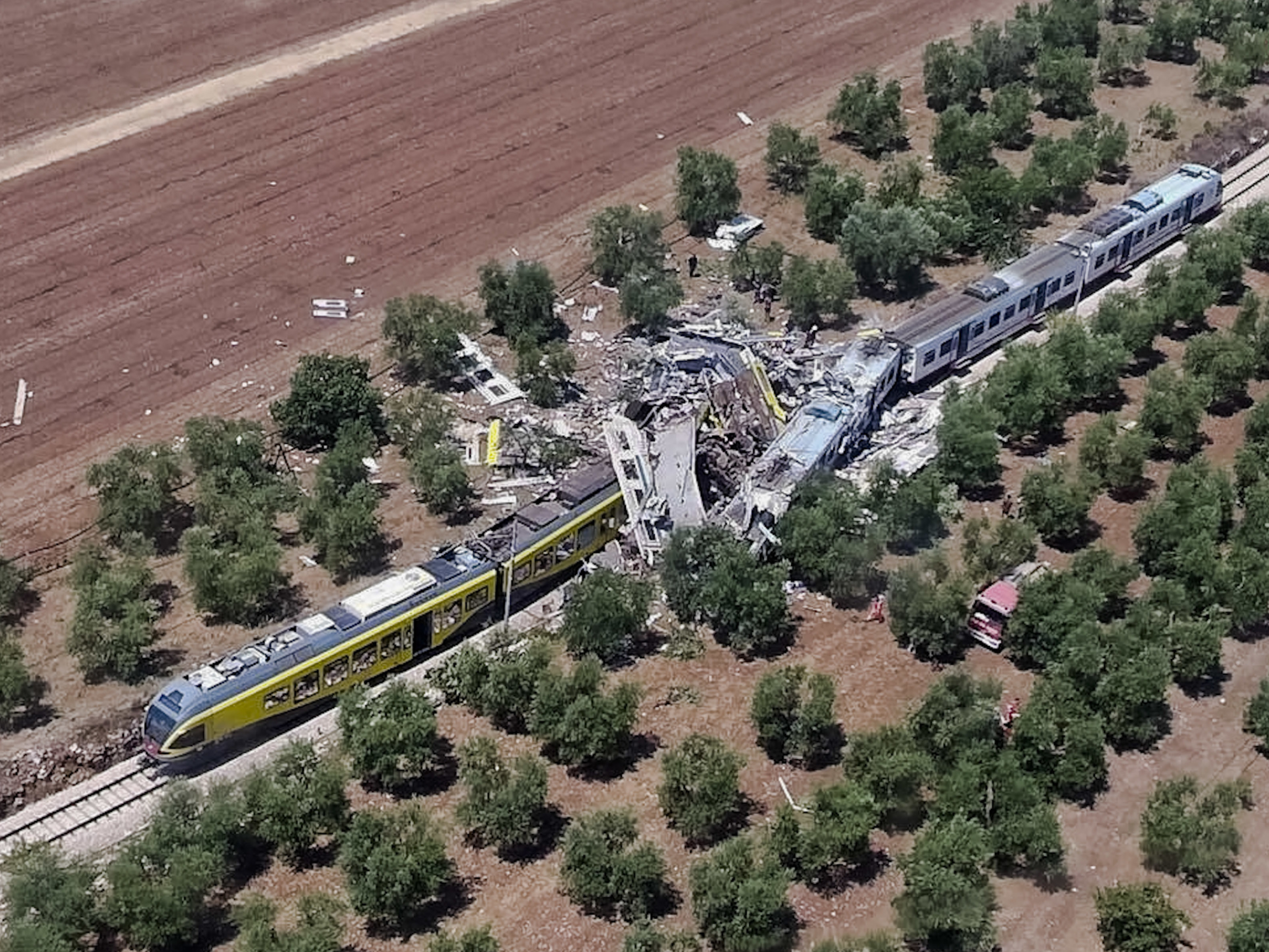 This aerial handout photo shows what is left of two commuter trains after their head-on collision in southern Italy on Tuesday.