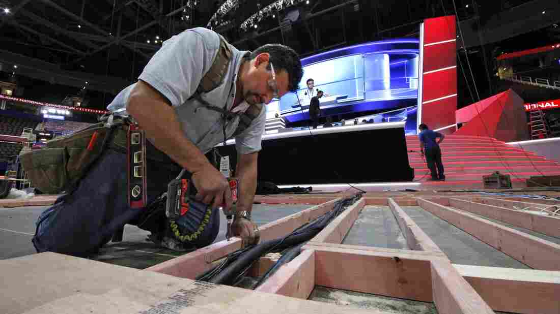 Carpenter Bill Kaim of Cleveland, works on the convention floor at the Quicken Loans Arena in downtown Cleveland, Ohio, in preparation for the upcoming Republican National Convention Wednesday, July 13, 2016. (AP Photo/Gene J. Puskar)