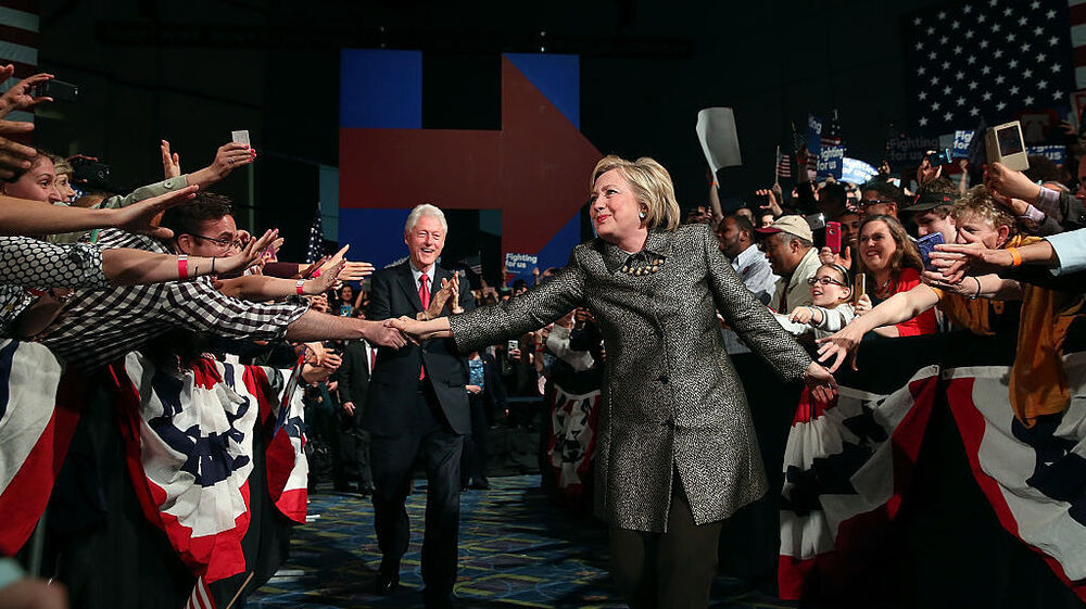 Democratic presidential candidate Hillary Clinton and former U.S. president Bill Clinton greet supporters during a primary night gathering on April 26 in Philadelphia, where Clinton will return for the Democratic National Convention later this month. (Getty Images)