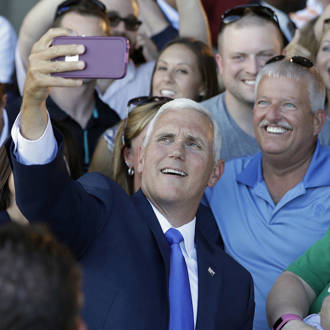 Republican vice presidential nominee Gov. Mike Pence of Indiana takes photos with supporters during a Welcome Home Rally on Saturday in Zionsville, Ind. Pence is a passionate advocate for school choice and state control over federal oversight. Republican vice presidential nominee Gov. Mike Pence of Indiana takes photos with supporters during a Welcome Home Rally on Saturday in Zionsville, Ind. Pence is a passionate advocate for school choice and state control over federal oversight.