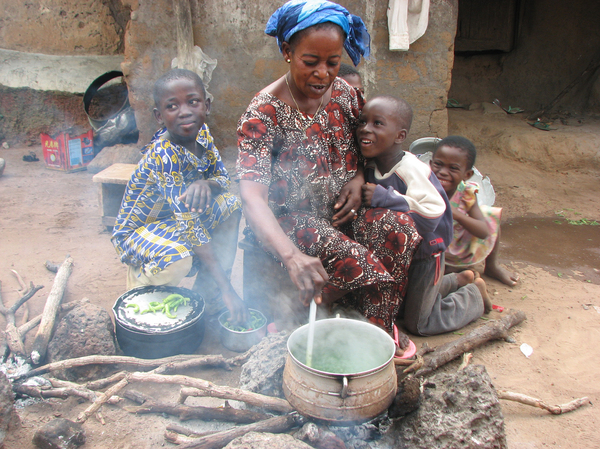 Banda resident Ama Georgina cooks a soup made from cassava leaves, a main source of nutrition during the hungry season.