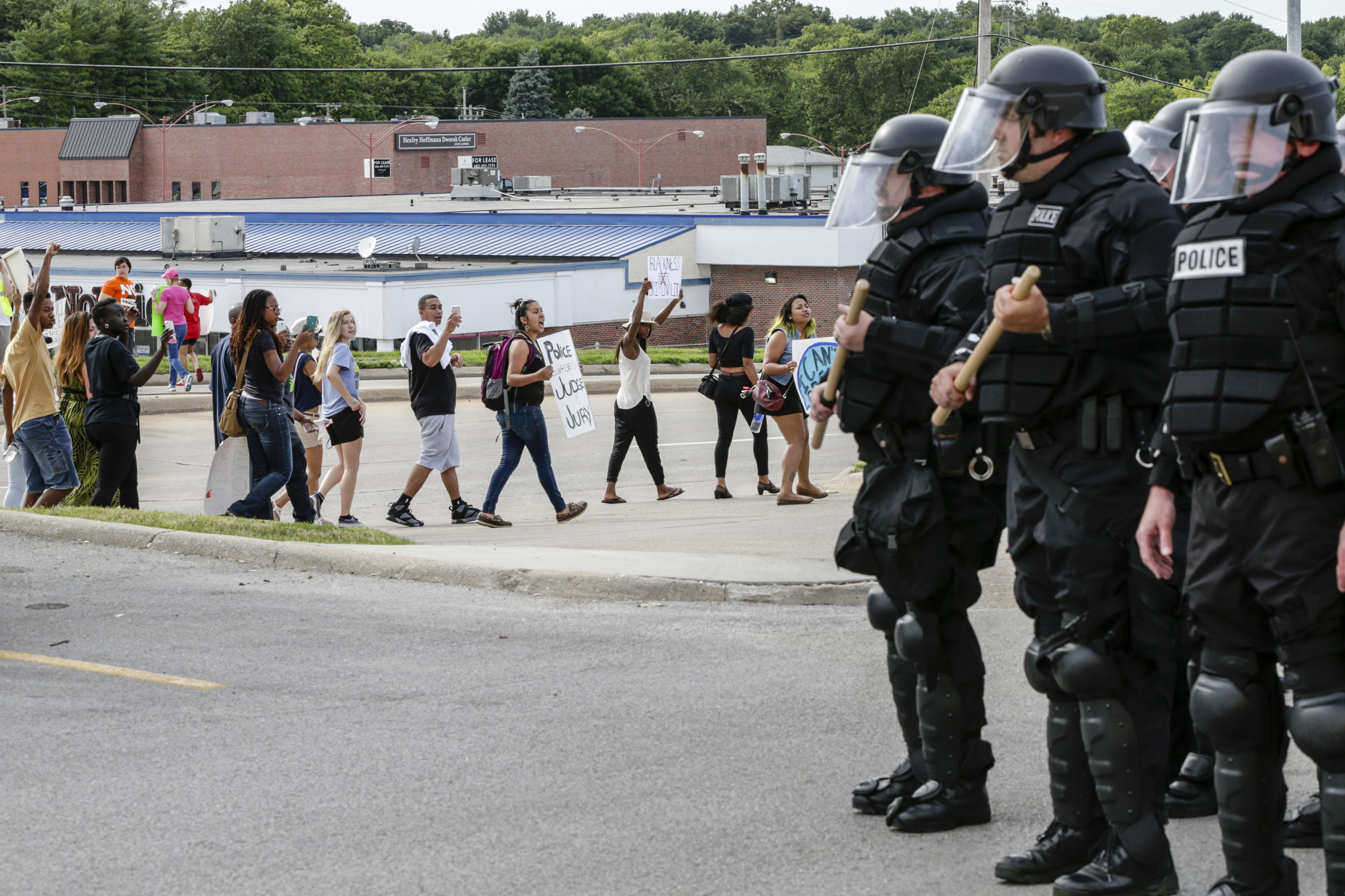 Police forces in riot gear keep watch on a demonstration in Omaha, Neb., on July 8. Participants were protesting the recent shooting death by police of Alton Sterling and Philando Castile.