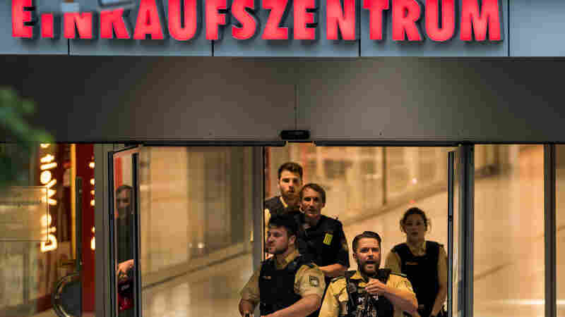 Police officers respond to a shooting at the Olympia Einkaufzentrum shopping center on Friday in Munich, Germany.