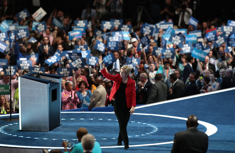 Sen. Elizabeth Warren leaves the stage after giving her remarks. "We are not going to be Donald Trump's hate-filled America," she said.