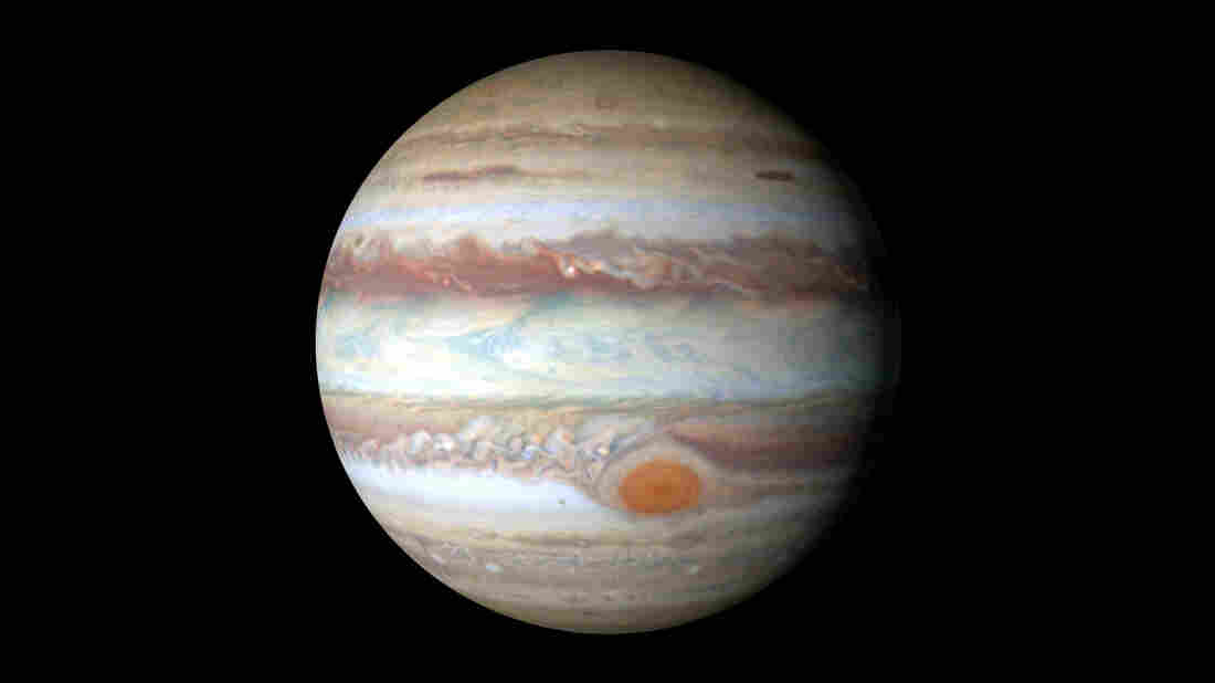 Though Jupiter's red spot looks small in this photo, it's actually about 10,000 miles wide  bigger than Earth's diameter.