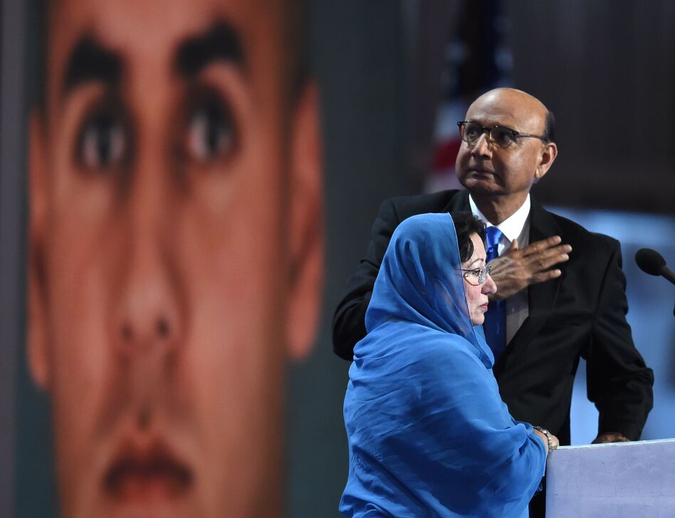 Khizr Khan, father of Humayun Khan, who was killed while serving in Iraq with the U.S. Army, gestures as his wife looks on during the final evening of the Democratic National Convention. (Timothy A. Clary/AFP/Getty Images)