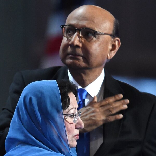 Khizr Khan, father of Humayun Khan, who was killed while serving in Iraq with the U.S. Army, gestures as his wife looks on during the final evening of the Democratic National Convention.