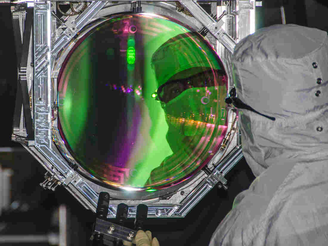 Lasers and mirrors are used to carefully measure shifts in space-time. To avoid contamination, protective clothing must be warn at all times. Lasers and mirrors are used to carefully measure shifts in space-time. To avoid contamination, protective clothing must be warn at all times.