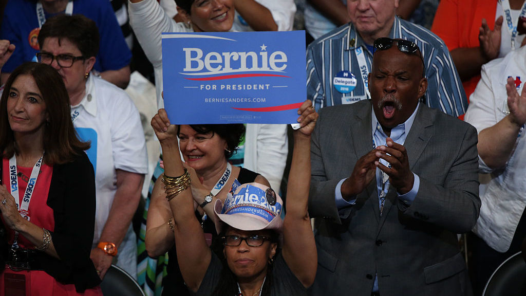 A delegate holds a campaign sign in support of Sen. Bernie Sanders, I-Vt., during the Democratic National Convention in Philadelphia.