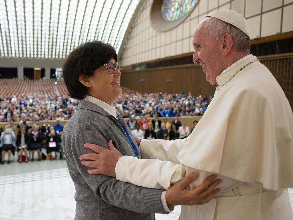 Pope Francis hugs Sister Carmen Sammut at the end of a meeting in May with hundreds of women who serve the Roman Catholic Church. The pontiff has appointed a commission to study whether women can serve as deacons. (AP)
