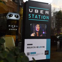 Mastering Local Ride-Sharing Etiquette for Seamless China Travel 4 A person using a smartphone in China.