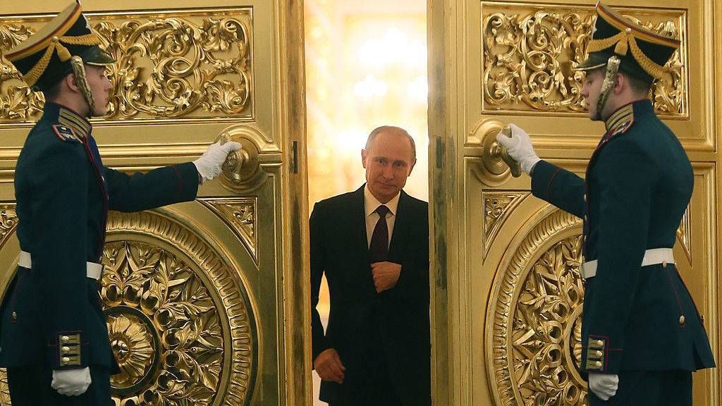 Russian President Vladimir Putin enters the St. George Hall of the Grand Kremlin Palace in Moscow. (AFP/Getty Images)