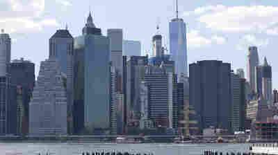 Kayakers paddle in the East River in front of the Lower Manhattan skyline in June 2016.