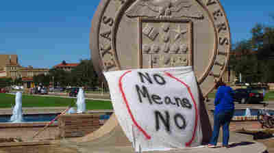 Texas Tech freshman Regan Elder helps drape a bed sheet with the message "No Means No" over the university's seal at the Lubbock, Texas campus in 2014 to protest what students say is a "rape culture" on campus.