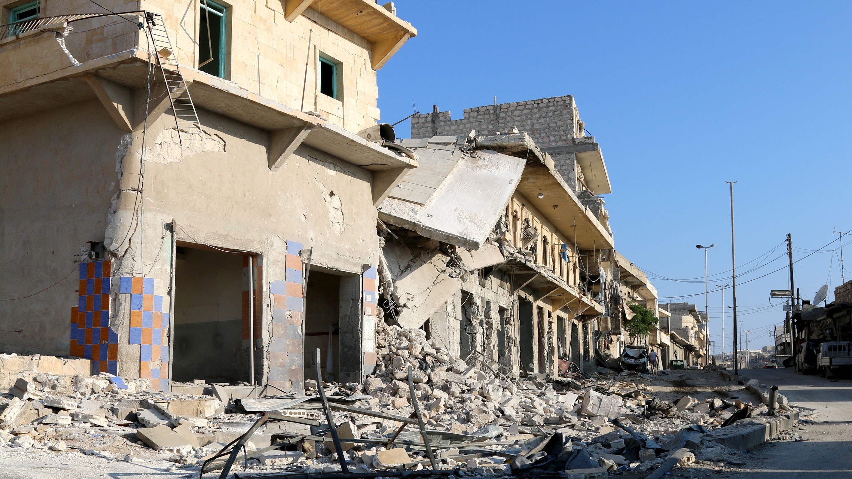 Buildings and debris in Aleppo's Darat Izza district, in Syria, on Sunday. (Getty Images)