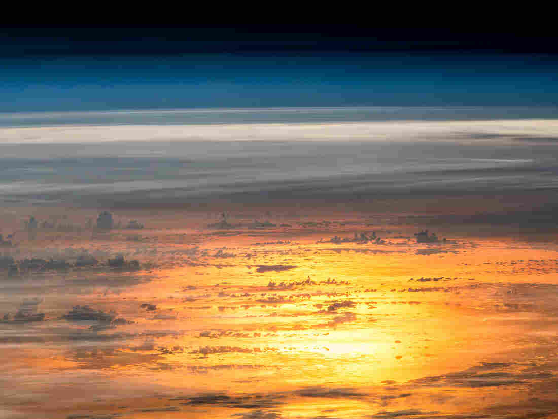 Expedition 47 flight engineer Jeff Williams of NASA captured a series of photos on April 25, 2016, for this composite image of the setting sun reflected by the ocean as seen from the International Space Station.