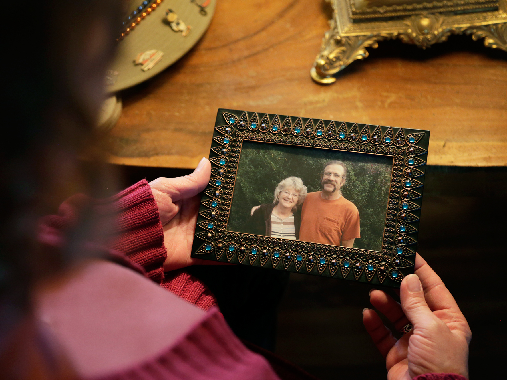 Greta Horner holds a photo of her and her husband Ed taken a few months before he died.