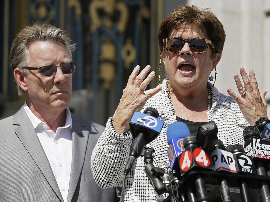 Liz Sullivan and Jim Steinle, the parents of Kate Steinle, at a news conference last year in San Francisco. Steinle was fatally shot in July 2015 by a man being sought for deportation. His trial has been delayed until next year. (Eric Risberg/AP)