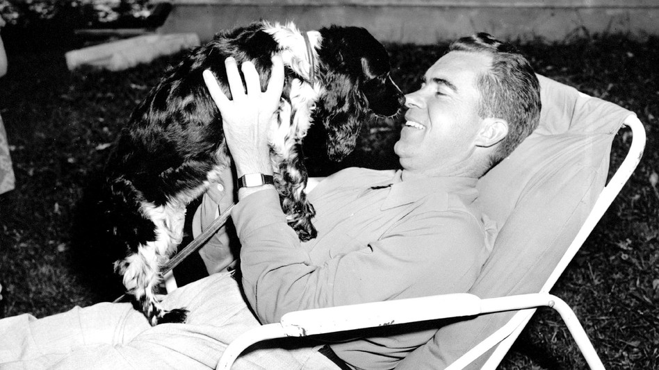 Richard M. Nixon with Checkers, his family's cocker spaniel, in 1952. Nixon, who was then the Republican vice presidential nominee, mentioned Checkers in a TV-radio report on his finances. (AP)