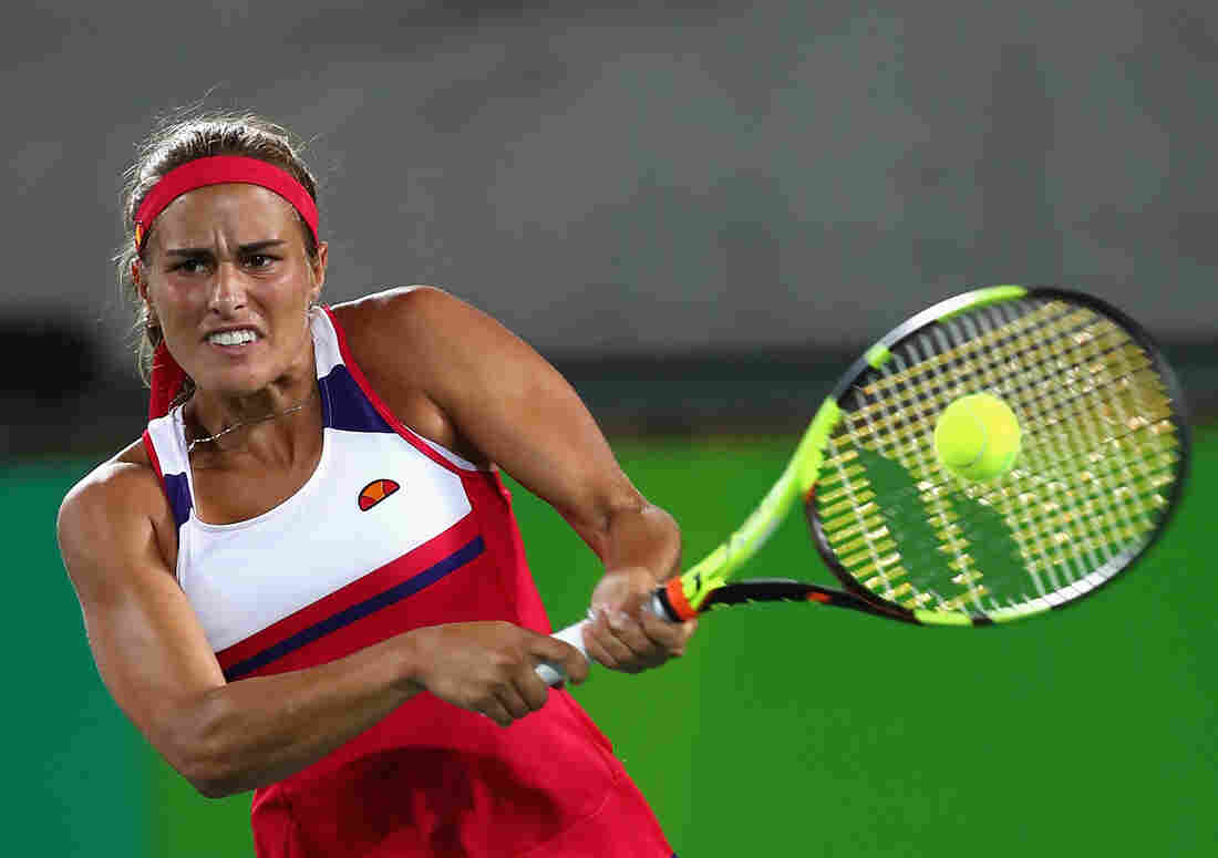 Monica Puig won Puerto Rico's first gold medal, ending a drought that began in 1948. Here, she returns a shot against Angelique Kerber of Germany during their women's singles gold medal match in Rio de Janeiro Saturday.