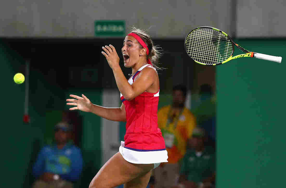 Monica Puig of Puerto Rico reacts after defeating Angelique Kerber of Germany in the women's singles gold medal match at the Rio Summer Olympics.