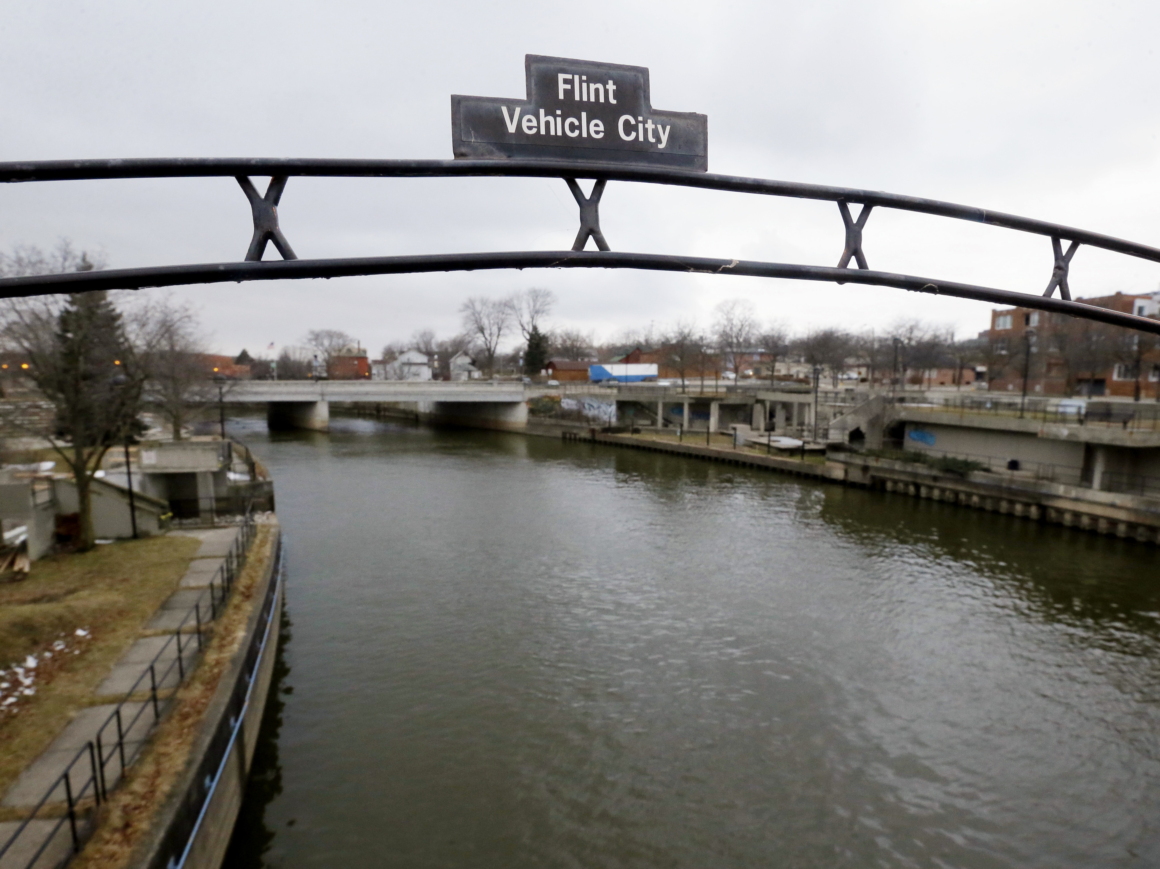 A sign over the Flint River in Flint, Mich. in January 2016.
