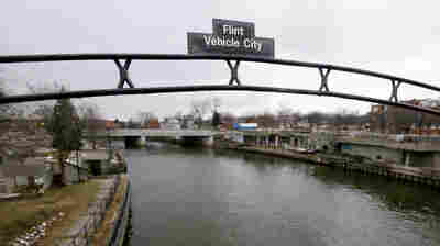 A sign over the Flint River in Flint, Mich. in January 2016.