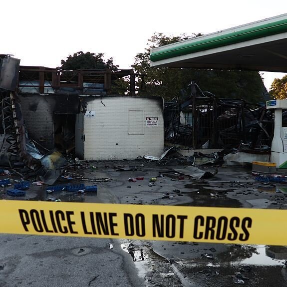 A damaged gas station after protesters set fire to several vehicles and businesses in Milwaukee. A damaged gas station after protesters set fire to several vehicles and businesses in Milwaukee.