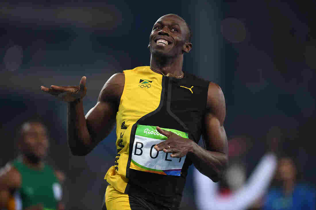 Usain Bolt of Jamaica wins the 100-meter final in 9.81 on Sunday, becoming the first man to ever win the race in three straight Olympics.