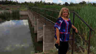 Lupe Dempsey, a retired federal agent, brings her Glock 9mm with her when she goes down to the Rio Grande. She believes the border is too wide open, evidenced by this unguarded metal walkway across the river in far West Texas.