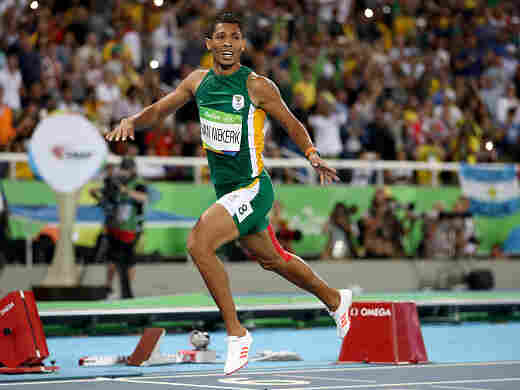 Wayde van Niekerk of South Africa celebrates after winning the Men's 400 meter final and setting a new world record of 43.03 on Day 9 of the Rio 2016 Olympic Games at the Olympic Stadium on Sunday.