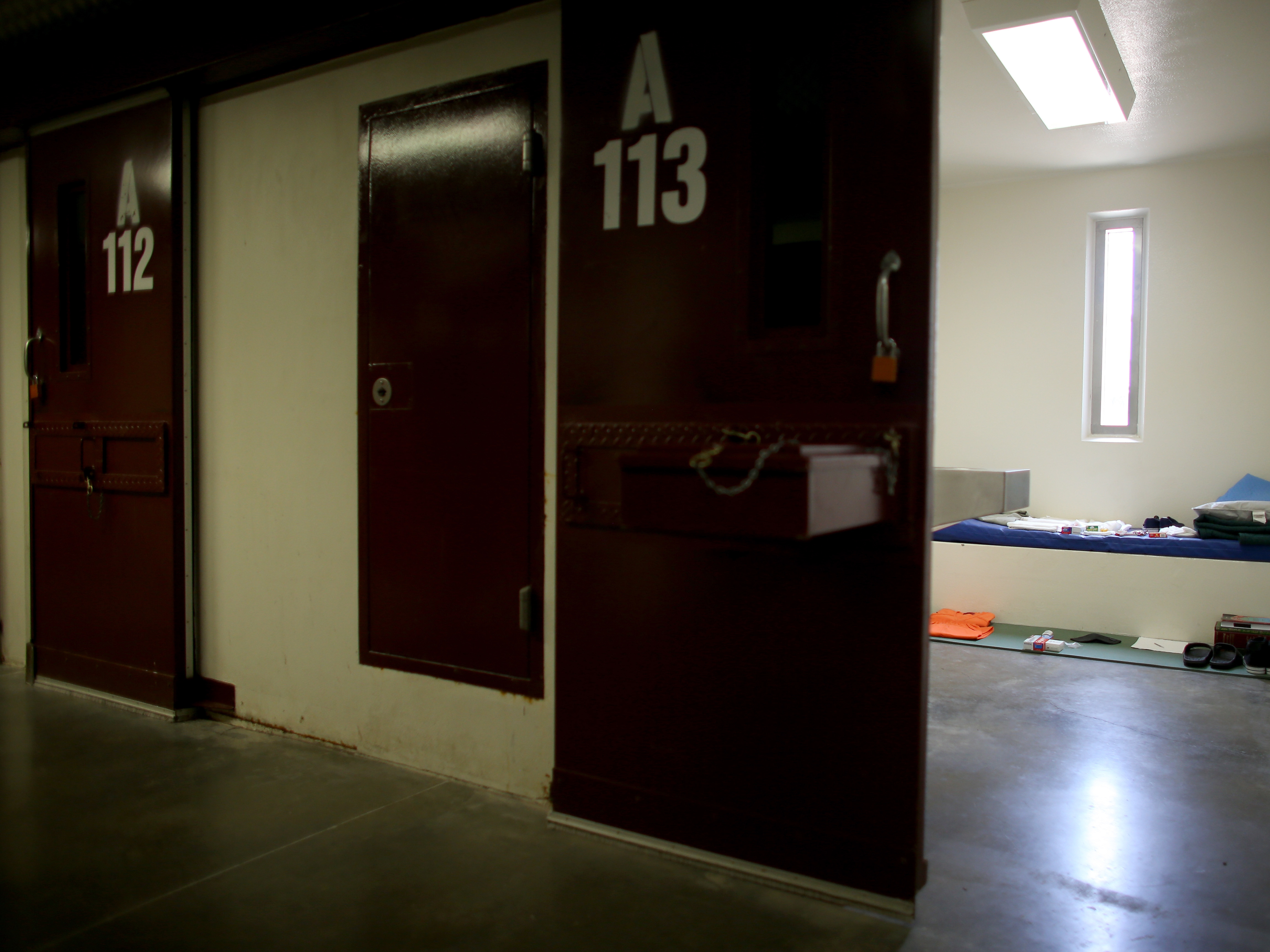 A static display shows the belongings of a typical inmate in a prison cell at camp V at the U.S. military prison in Guantanamo Bay, Cuba, in 2013.