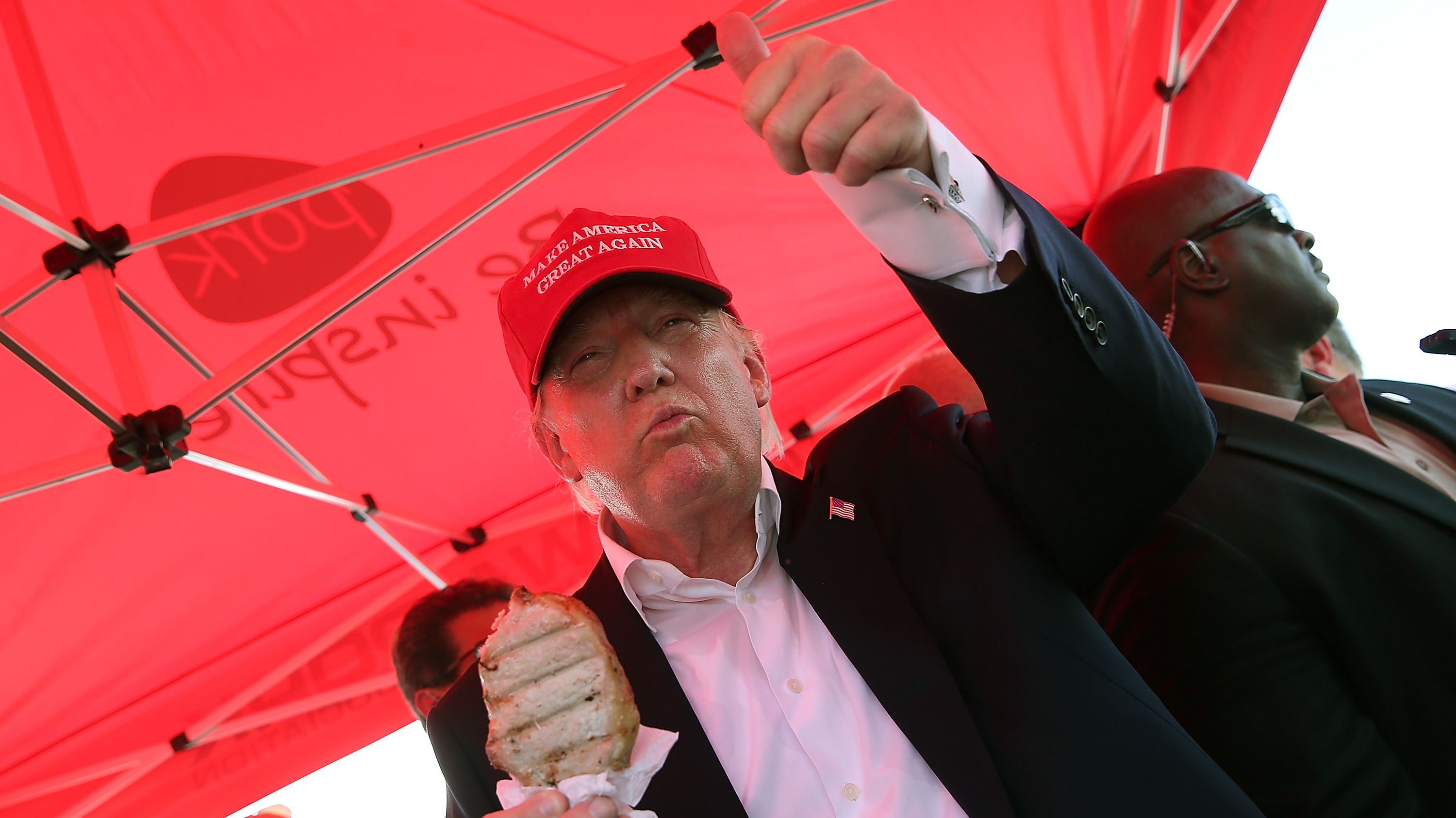 Republican presidential candidate Donald Trump eats a pork chop on a stick at the 2015 Iowa State Fair. (Getty Images)