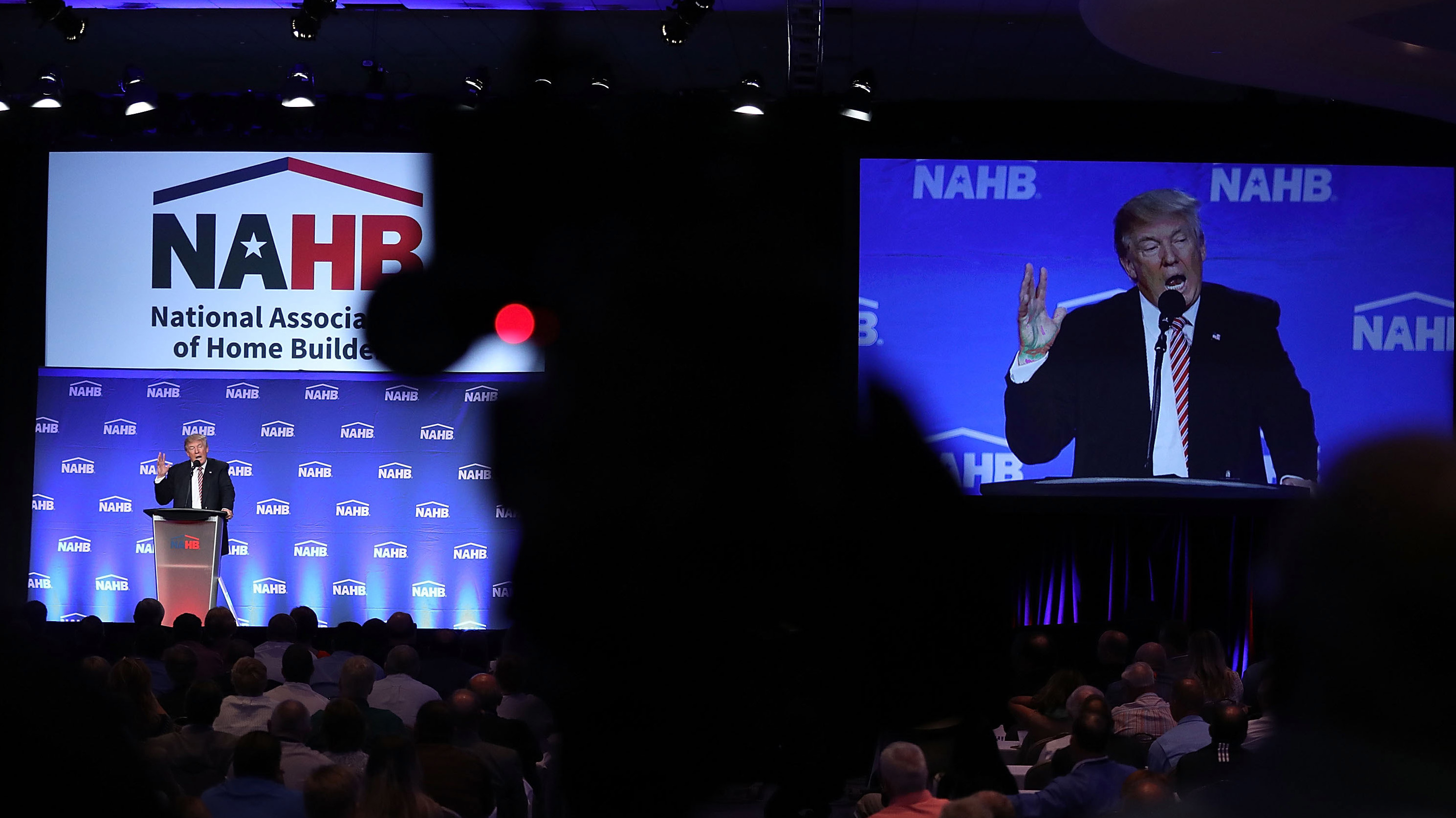 Republican presidential nominee Donald Trump is captured by a TV camera during an address to the National Association of Home Builders in Miami Beach, Fla., on Aug. 11. (Getty Images)