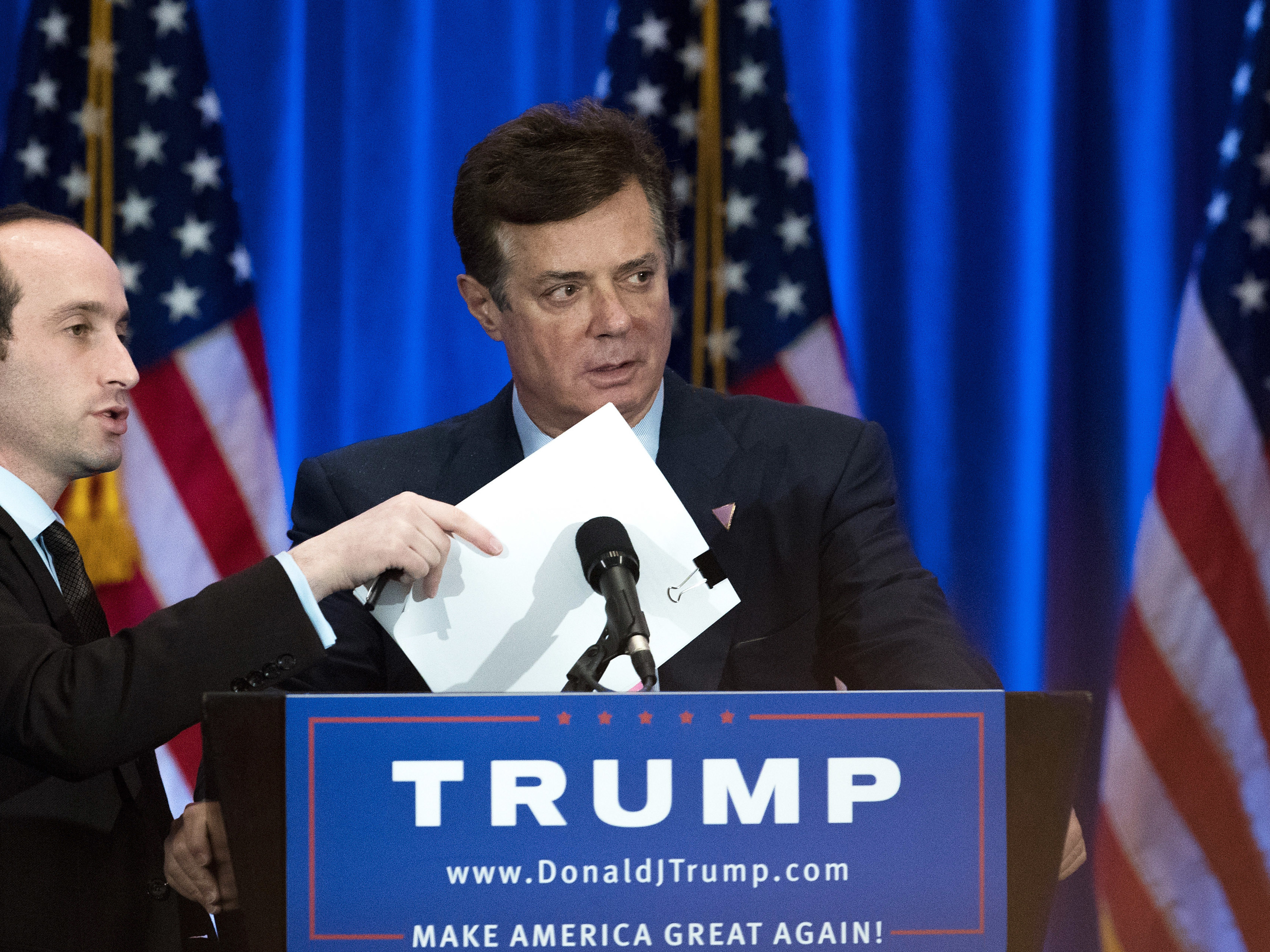 Campaign chairman Paul Manafort checks the podium before Donald Trump speaks during a June event at Trump SoHo Hotel.