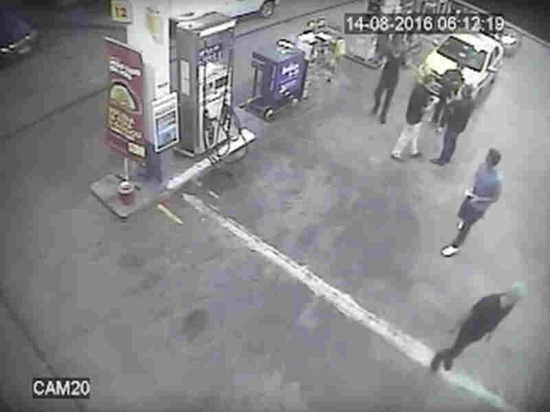 In this surveillance video frame released by Brazilian police, swimmers from the U.S. Olympic team appear with Ryan Lochte, right, at a gas station during the Rio Olympics. A top Brazil police official said the swimmers damaged property at the gas station.