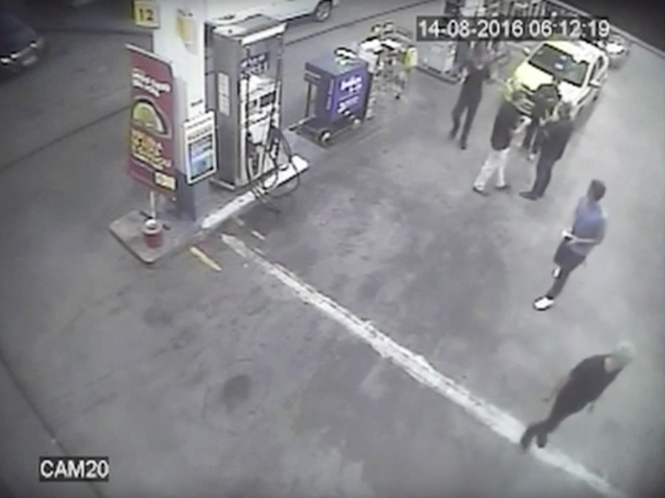 In this surveillance video frame released by Brazilian police, swimmers from the U.S. Olympic team appear with Ryan Lochte (right) at a gas station last weekend. A top Brazil police official said the swimmers damaged property at the gas station. (Brazil Police/AP)