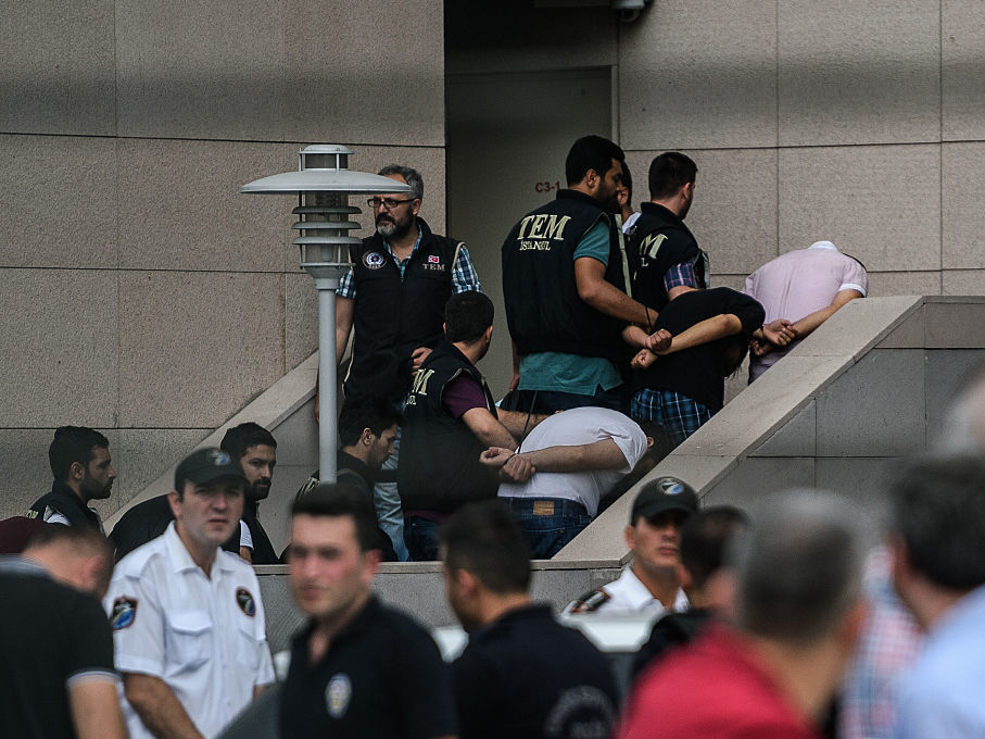 Detained Turkish soldiers who allegedly took part in a military coup arrive with their hands bound behind their backs at the Istanbul Justice Palace on July 20, 2016, following the failed military coup attempt of July 15.