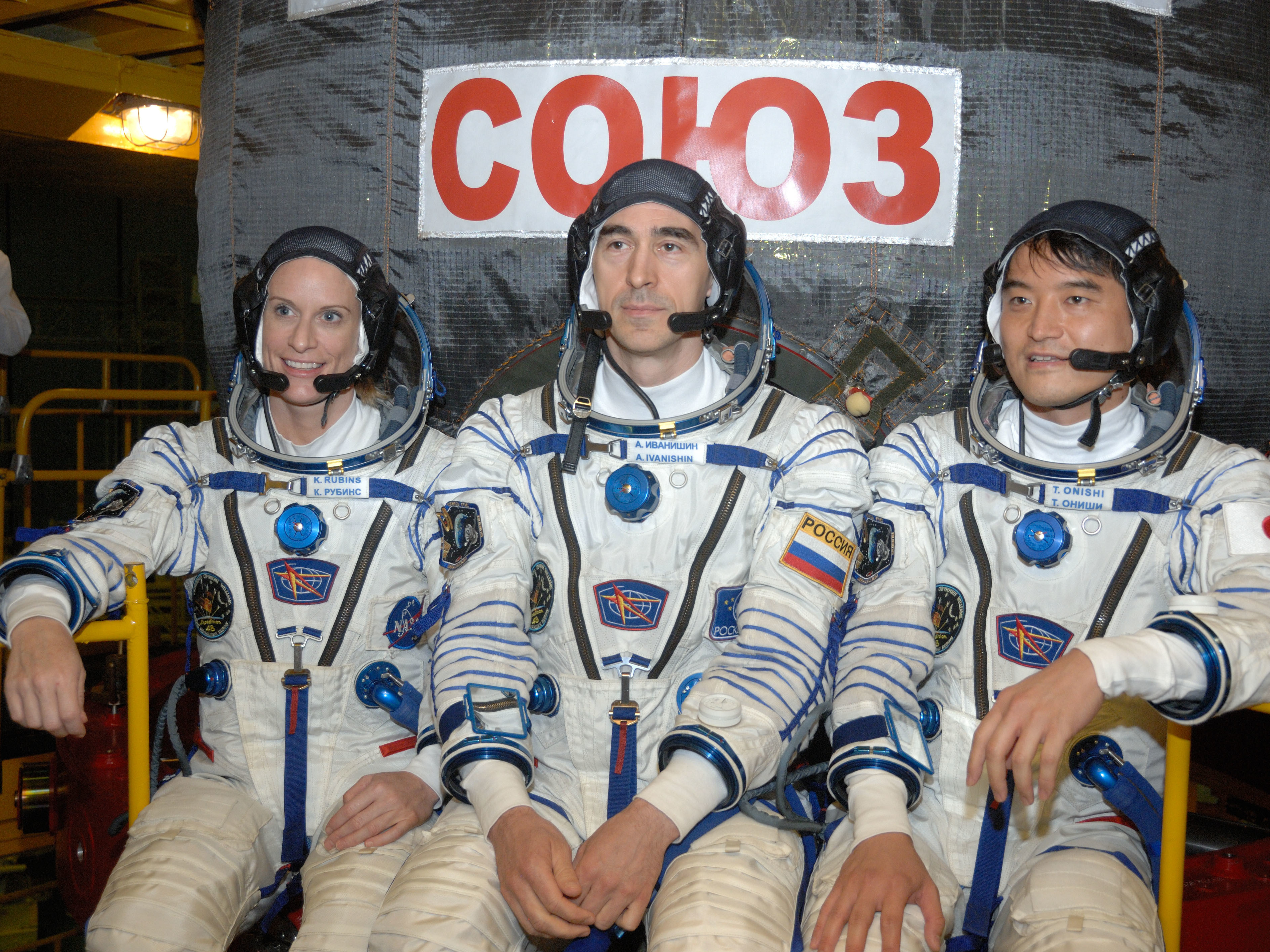 In the Integration Facility at the Baikonur Cosmodrome in Kazakhstan, Expedition 48-49 crewmembers (left to right) Kate Rubins of NASA, Anatoly Ivanishin of Roscosmos and Takuya Onishi of the Japan Aerospace Exploration Agency prepared for a four-month mission on the International Space Station in this June 2016 photo. (NASA)