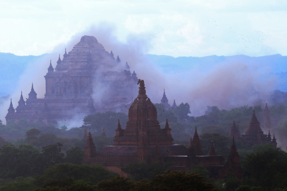The ancient Sulamuni temple is surrounded by a cloud of dust as a magnitude 6.8 earthquake hit Bagan, Myanmar, on Wednesday. (Soe Moe Aung/AFP/Getty Images)