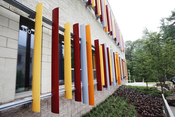 Colored blinds hang outside of a first grade window at the new Sandy Hook Elementary School.