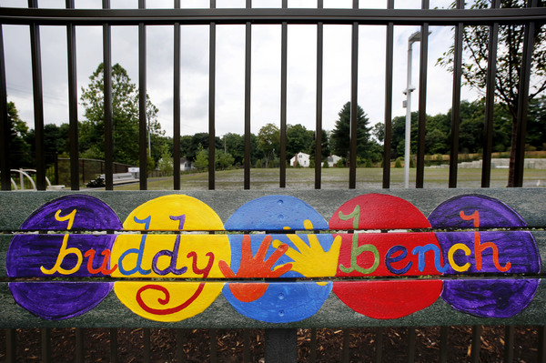 A playground bench is colorfully decorated at the new Sandy Hook Elementary School.