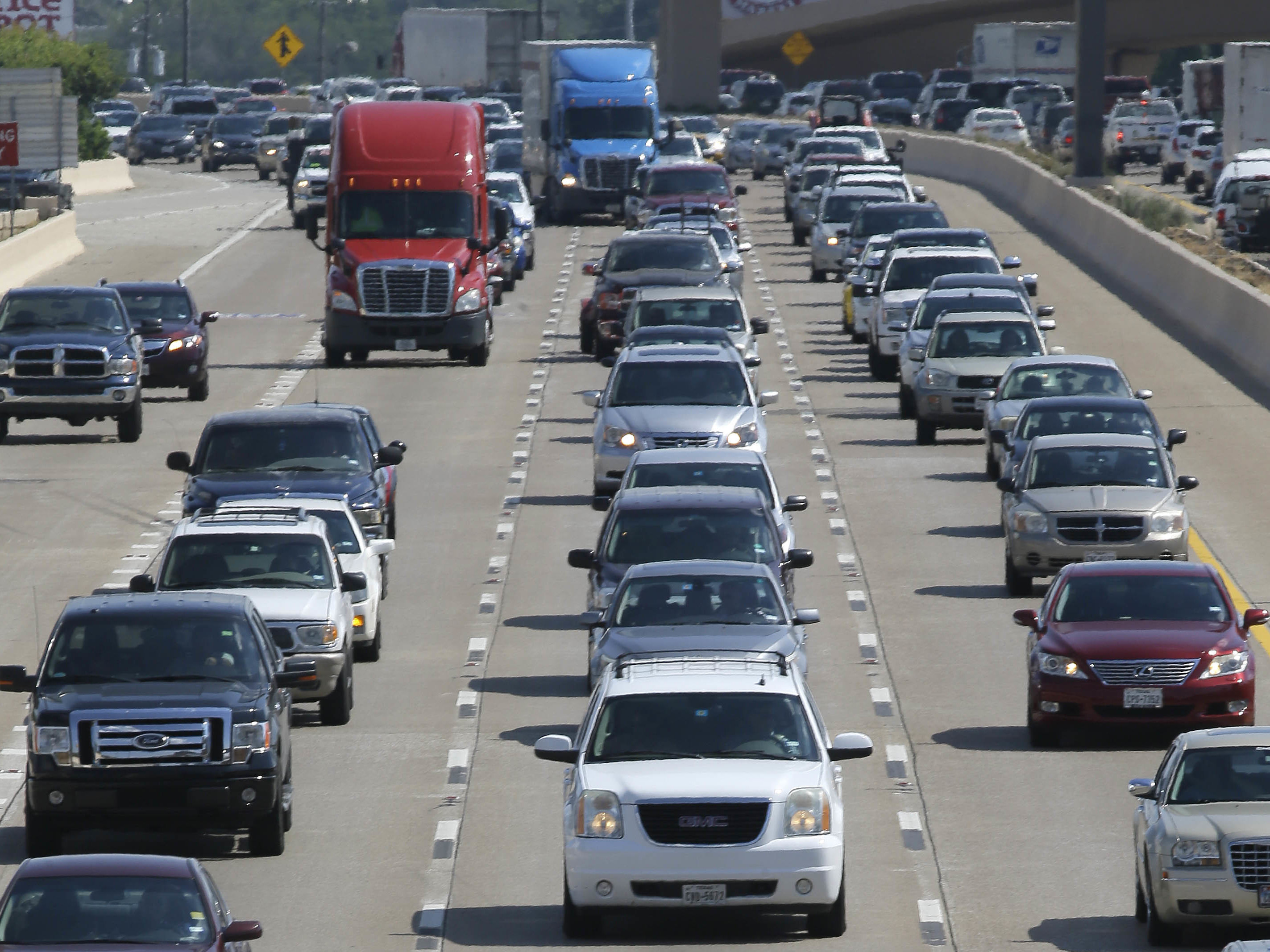 Drivers work their way out of Dallas during rush hour on July 1. The U.S. is on track to break the annual record for gas consumption this year.